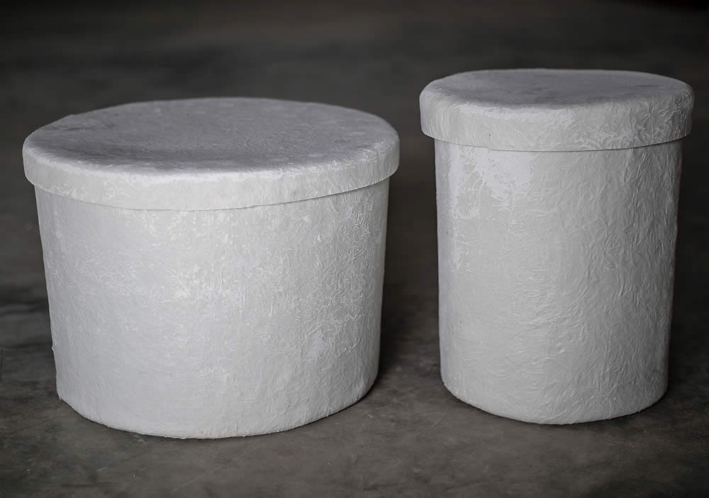 Round Fiberglass Urn Vaults are available in two sizes. Shown here are the small vault: 11.5" OD x 14.5" deep, and the large vault: : 17.5" OD x 12.5" deep.